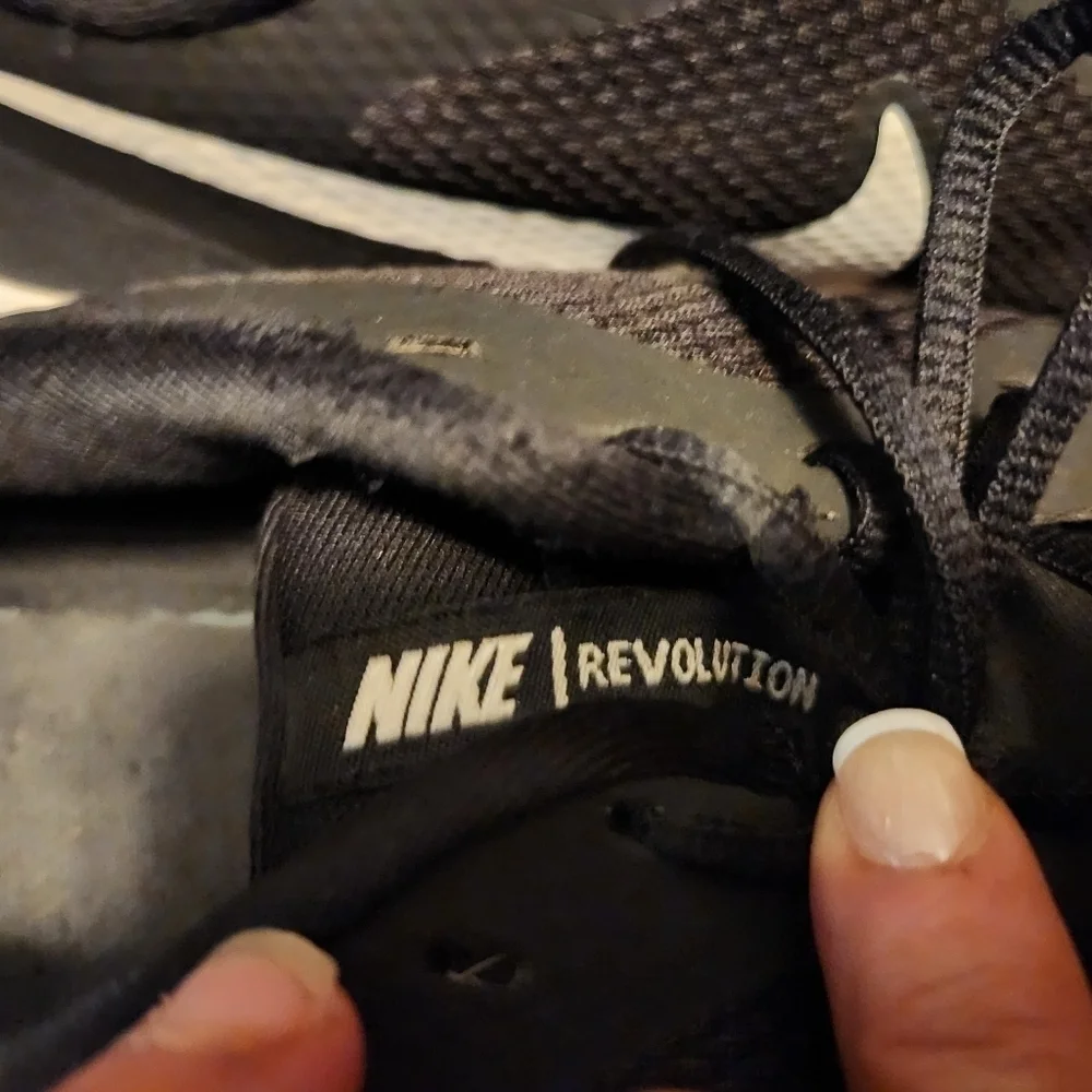 NIKE Revolution sneakers size 10 black & white.